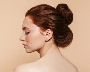 Side profile of a woman with a natural-looking nose