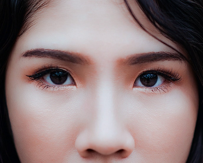 Close-up of woman’s eyes with long, full lashes after using Latisse® eyelash growth treatment