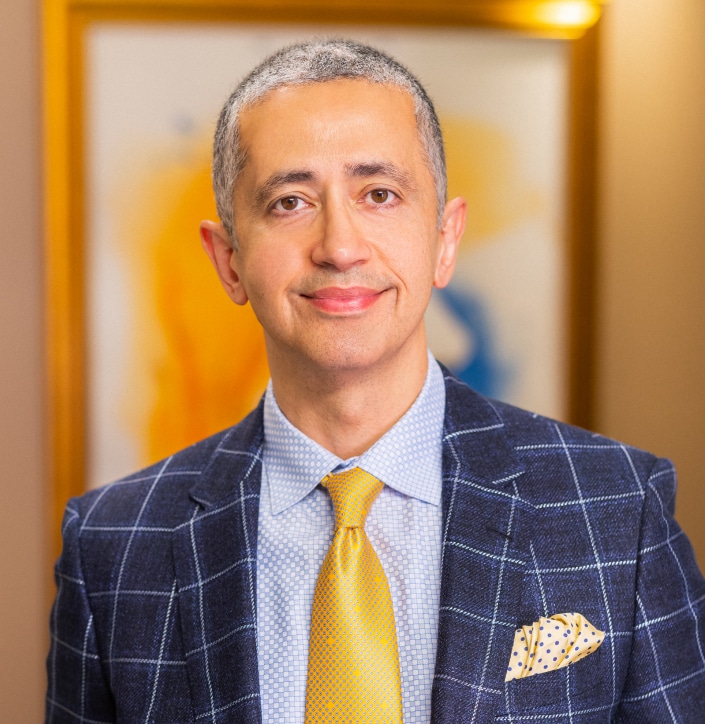 Professional portrait of Dr. Naderi, facial plastic surgeon offering personalized rhinoplasty consultations with computer-generated outcomes