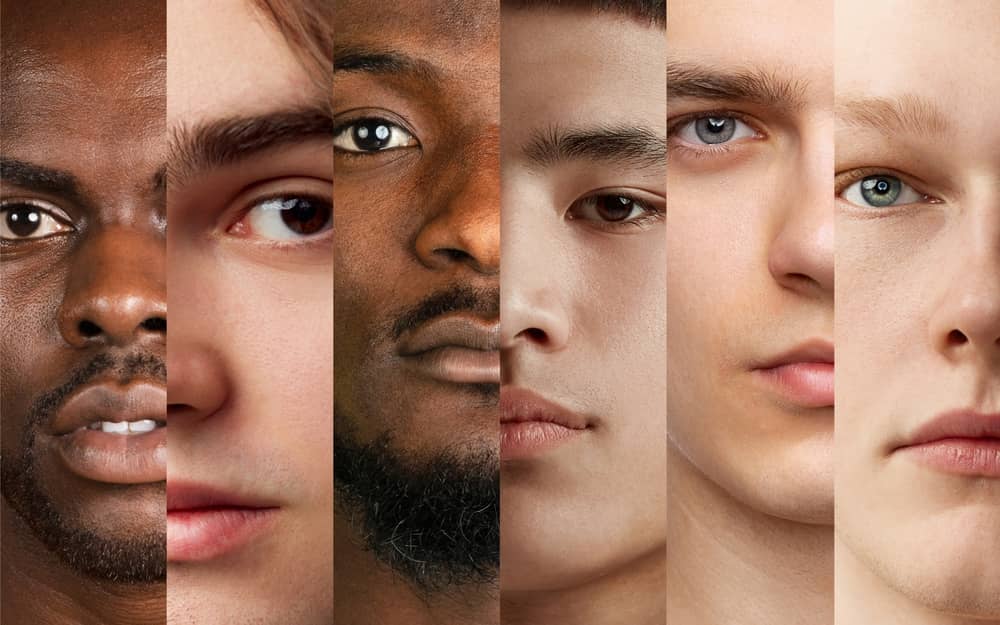 Diverse male faces side-by-side illustrating UltraClear laser’s safe scar treatment results across all skin types.