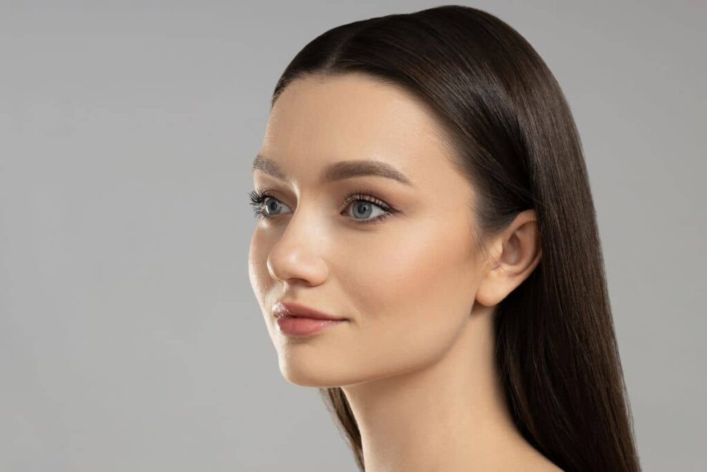 Woman with clear, youthful skin and subtle facial expression representing customized Botox results through unit-based pricing.