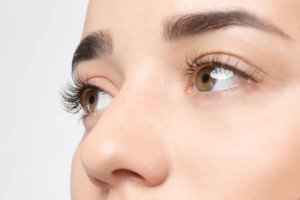 Closeup of woman’s nose and eyes showing smooth nasal bridge and natural results from preservation rhinoplasty.