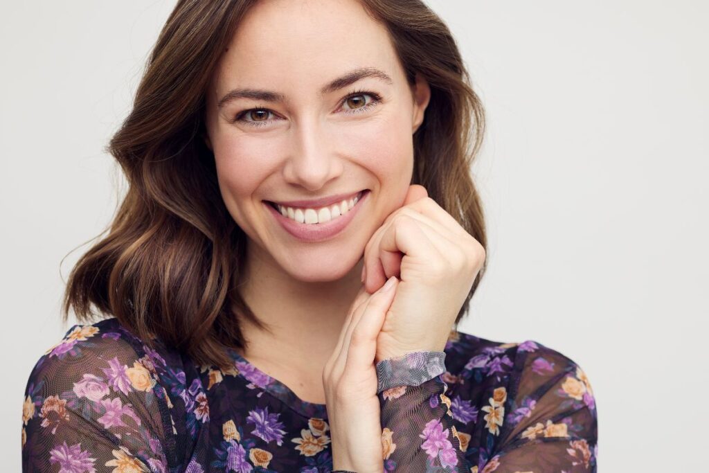 Woman with smooth skin and balanced facial contours illustrating long-lasting deep plane facelift results with natural aging