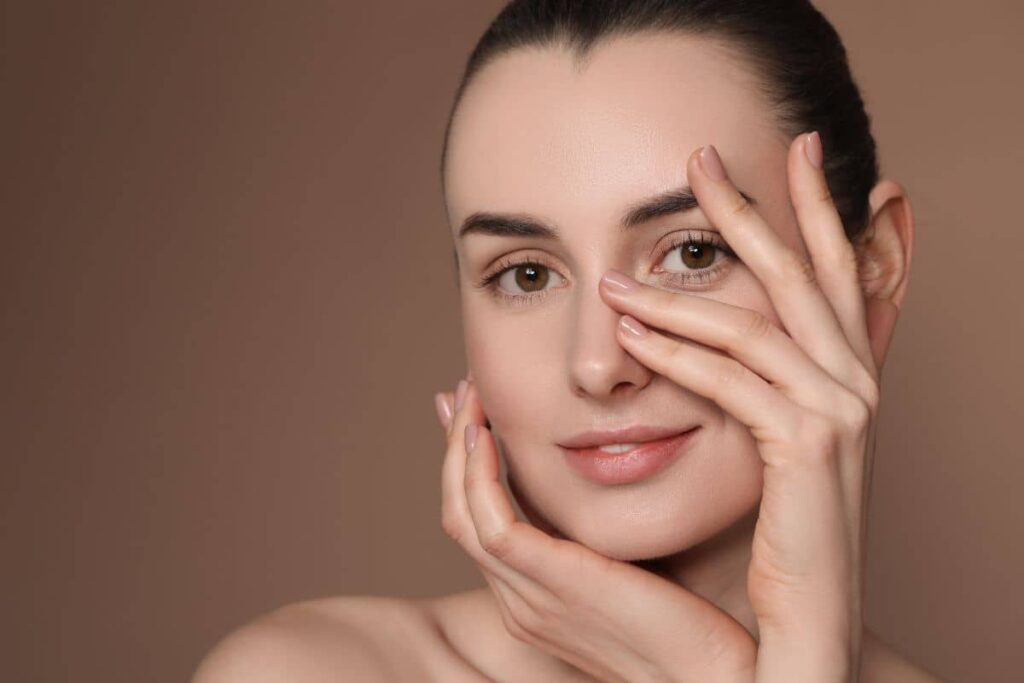 Woman showing refreshed, youthful eyes after eyelid surgery, reflecting results from proper care instructions