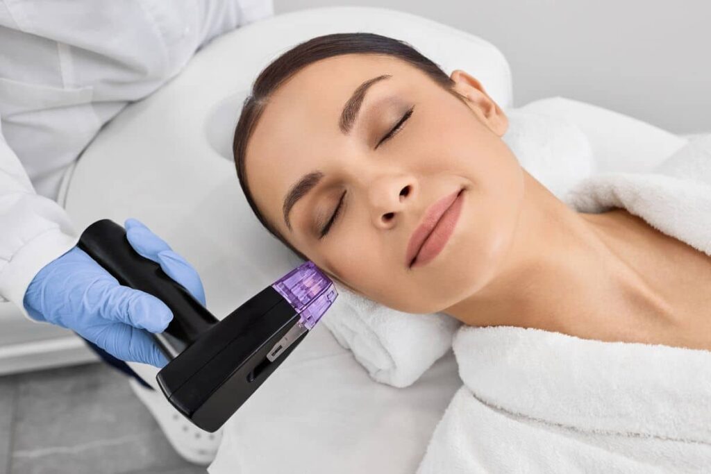 Woman receiving RF microneedling treatment to tighten skin and stimulate collagen for non-surgical facial rejuvenation