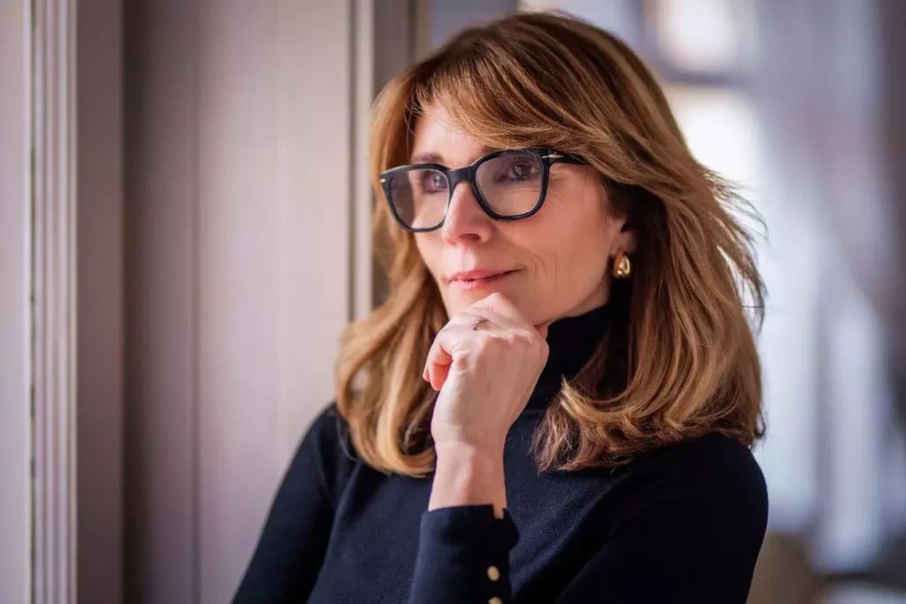 Woman considering facelift surgery and natural-looking results.