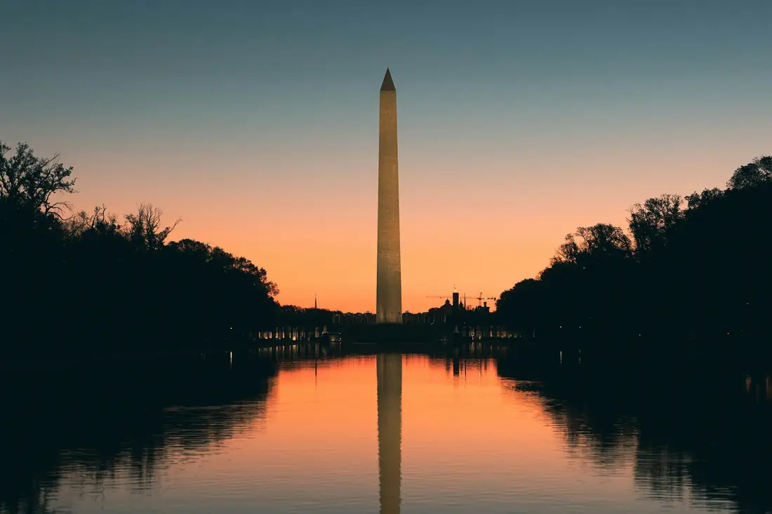 The Washington Monument at sunset, reflected in the Reflecting Pool in Washington, DC